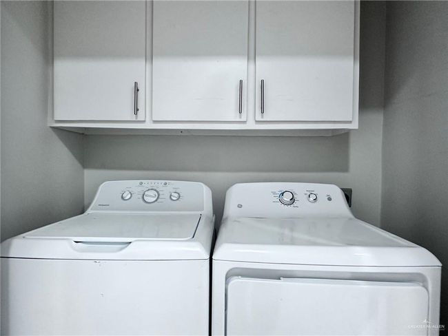 Laundry area with cabinet space and washing machine and dryer | Image 10