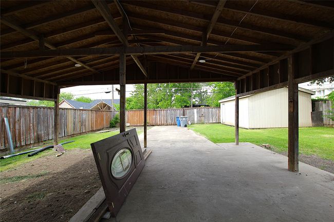 View of patio with a fenced backyard | Image 19