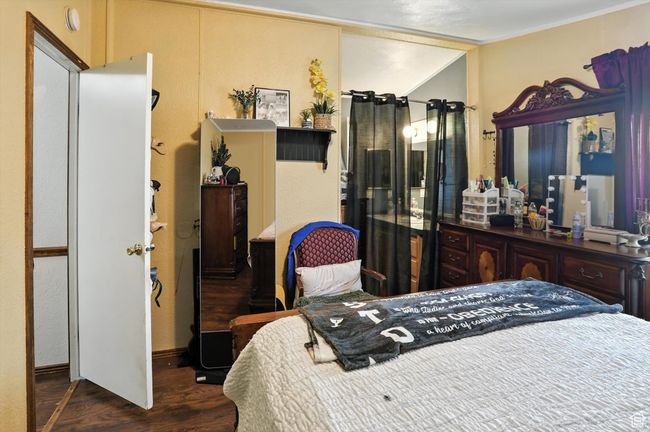 Bedroom featuring wood finished floors | Image 11