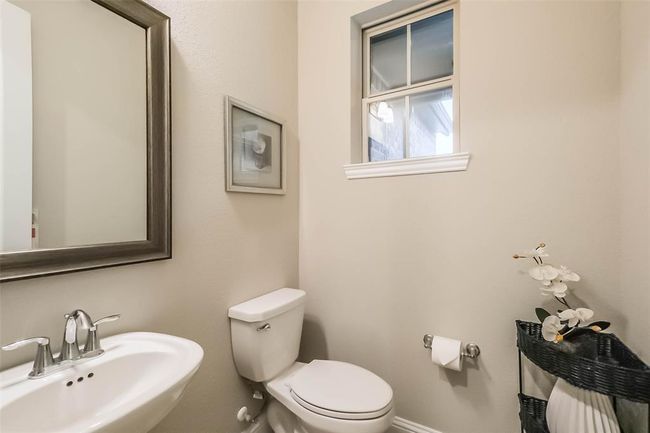 First floor powder bath is perfect for guests. | Image 24
