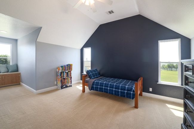 Bedroom #4 upstairs with dormer window in addition to 2 other windows. | Image 27