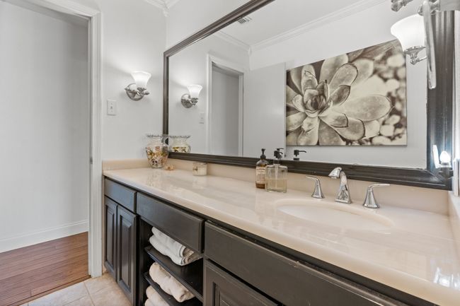 Hall Bathroom with tile patterned floors, long vanity, and crown molding | Image 21