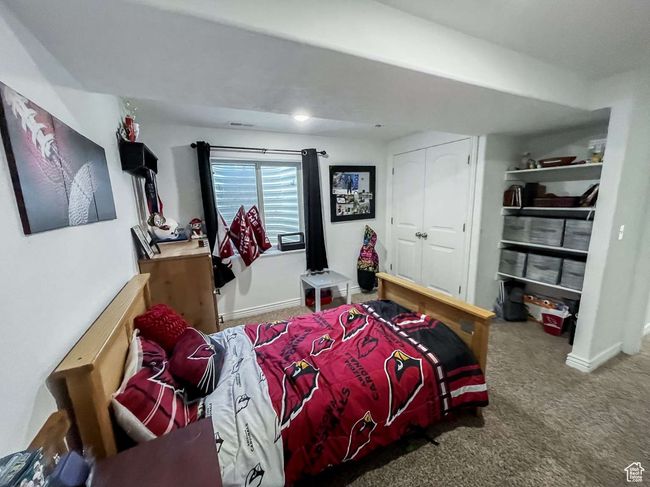 Bedroom with carpet flooring and a closet | Image 22