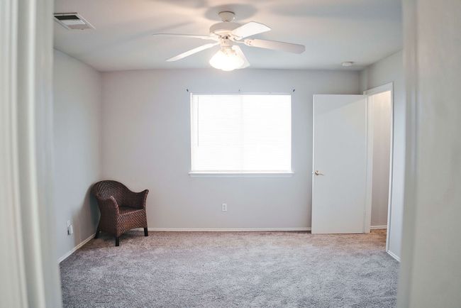 Unfurnished room featuring carpet and a ceiling fan | Image 20