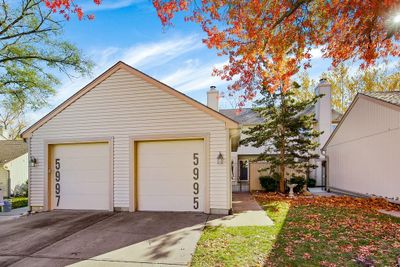 View of front of property with a garage and an outbuilding | Image 2