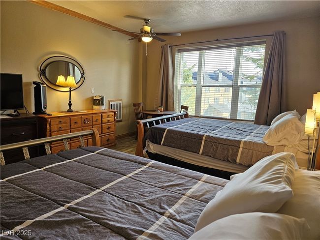 Bedroom featuring a textured ceiling | Image 13