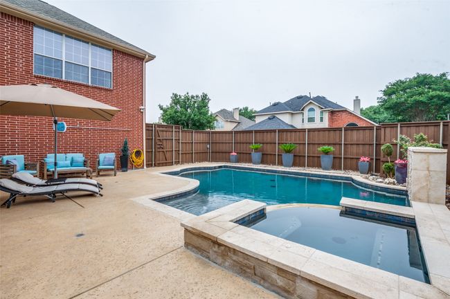 View of swimming pool with a patio area, and imagine the spa at the end of a long day! | Image 5