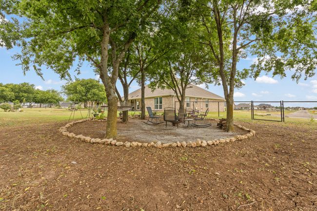 View of yard featuring a gate | Image 36