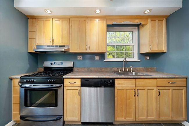 Kitchen: Stainless appliances including Gas Stove. | Image 11
