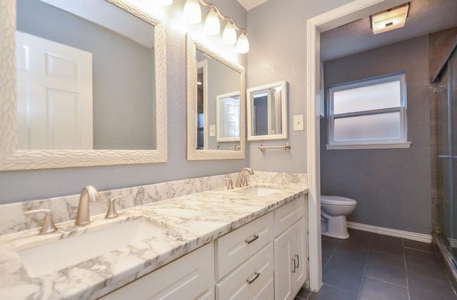 Full hall bath- beautifully updated! Double sinks, large vanity, lots of storage! | Image 20
