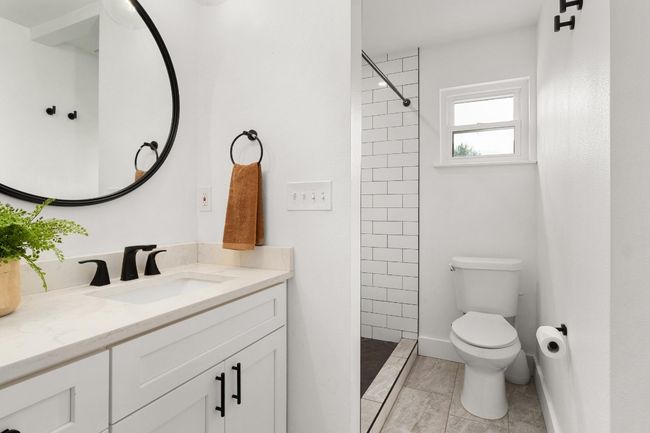 Full bath featuring vanity and a tile shower | Image 14