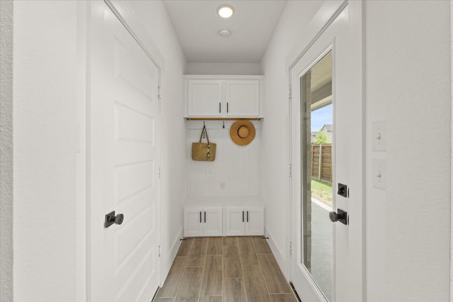 Mudroom featuring baseboards and wood finished floors | Image 18