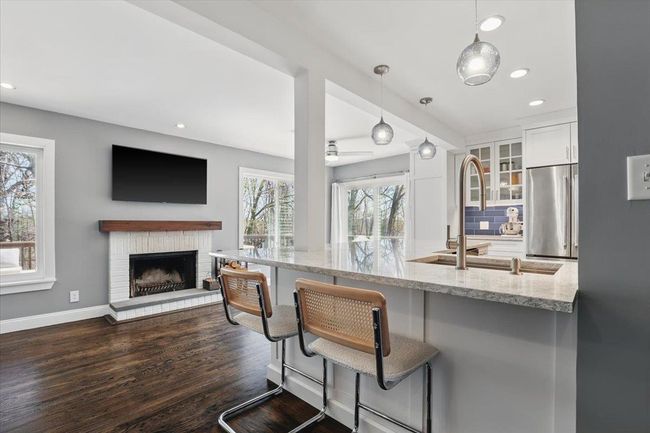 Kitchen with views of the fireplace | Image 8