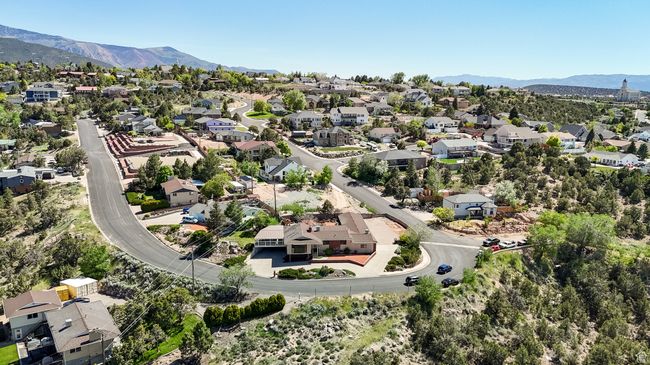 Aerial view of residential area featuring a mountainous background | Image 58