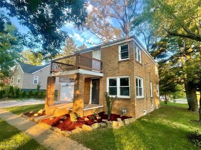 View of front facade featuring a front lawn and a balcony | Image 2