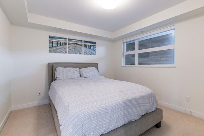 Bedroom featuring light carpet, ensuite bath, and baseboards | Image 15