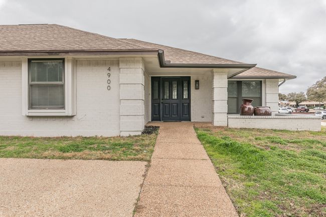 Unit 4900 View of exterior entry with a yard | Image 4
