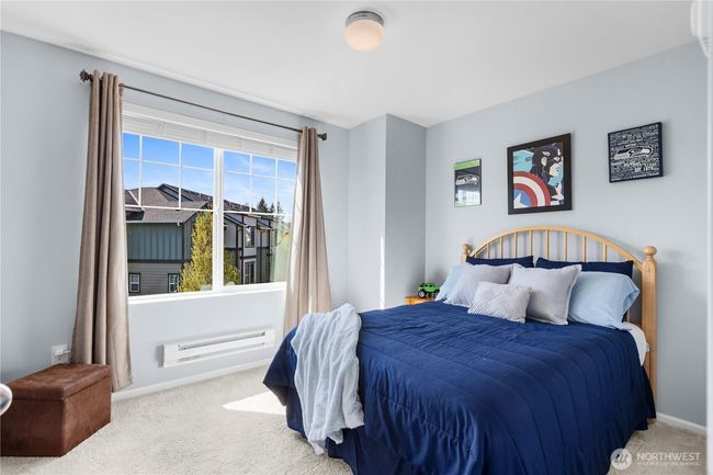 Second bedroom abounds with natural light from the afternoon sun. | Image 14