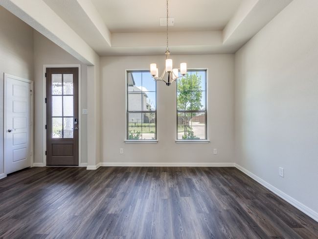 Whether it's elegant dinner parties or cozy family meals, this beautiful dining room is perfect for any occasion! | Image 4