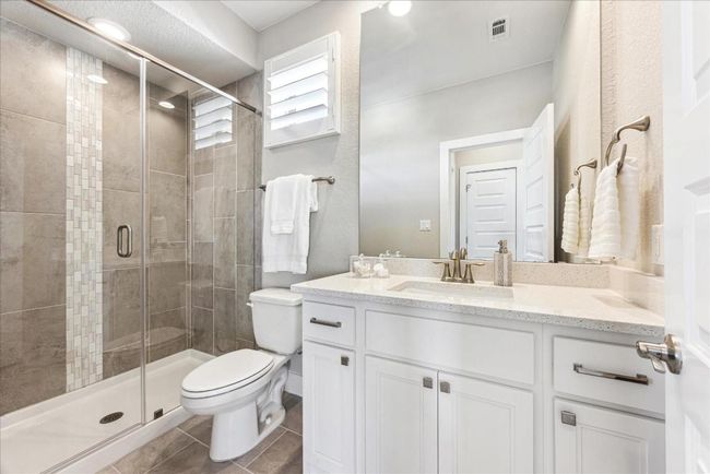 Adjoing full bath in the hallway has a walk in shower. | Image 34