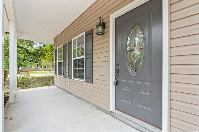 Doorway to property with covered porch | Image 32