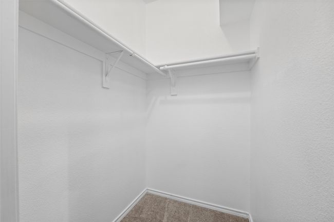 Spacious closet with carpet flooring | Image 31