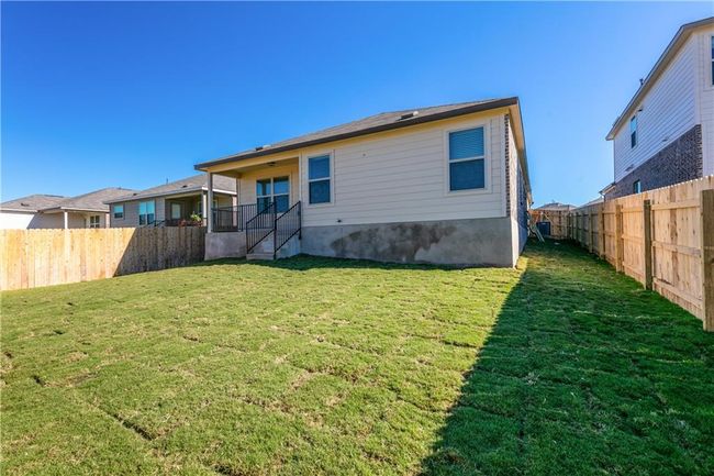 Back of property with a fenced backyard | Image 22