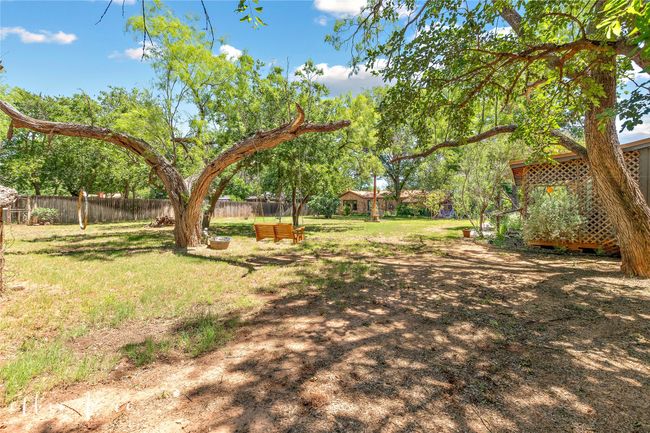 Ready to host a wedding! This property has almost an acre of paradise! | Image 35