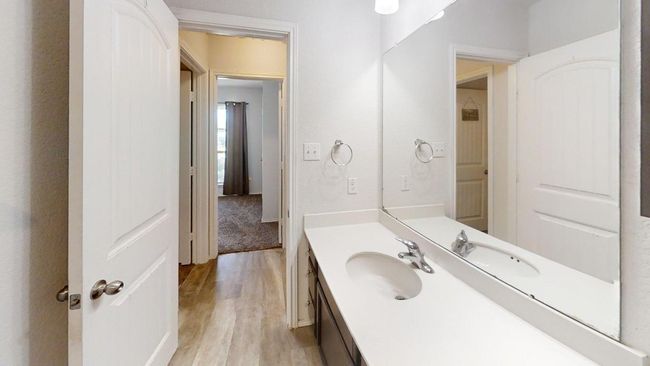 Bathroom with wood finished floors and vanity | Image 8