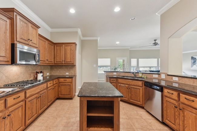 Welcome to the hub of the home - a large gourmet kitchen to cook and connect with friends and family! | Image 6