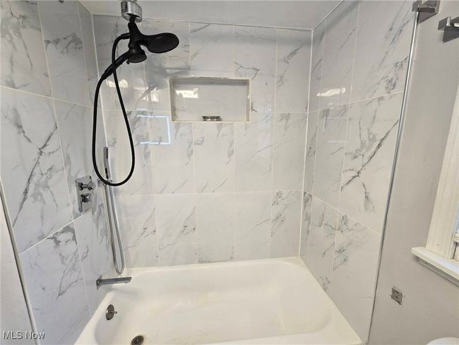 Bathroom featuring shower / bath combination | Image 38