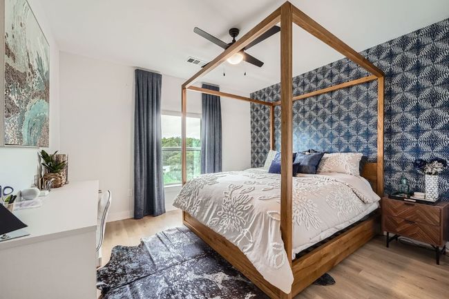 Bedroom featuring light wood-type flooring and ceiling fan | Image 11