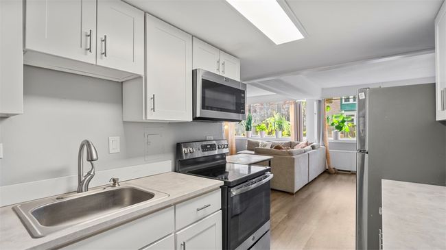 Former wall removed - open concept prevails | Image 9