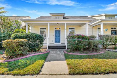 View of front facade with a porch and a front yard | Image 1