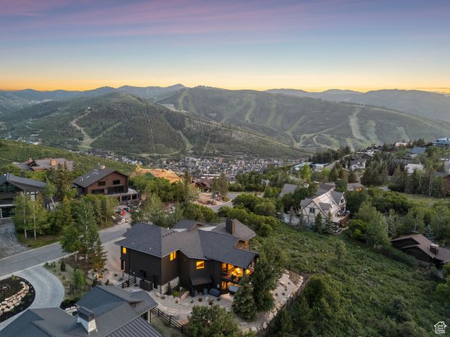 View of mountain backdrop featuring nearby suburban area | Image 94