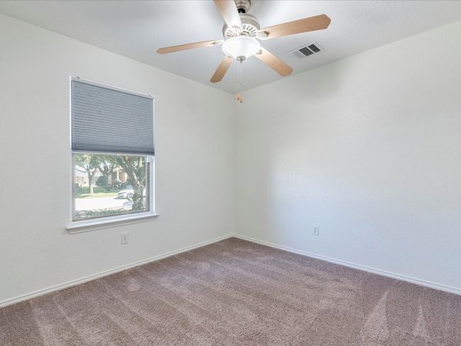 The other secondary bedroom overlooks the gorgeous shade trees in the front yard. | Image 21