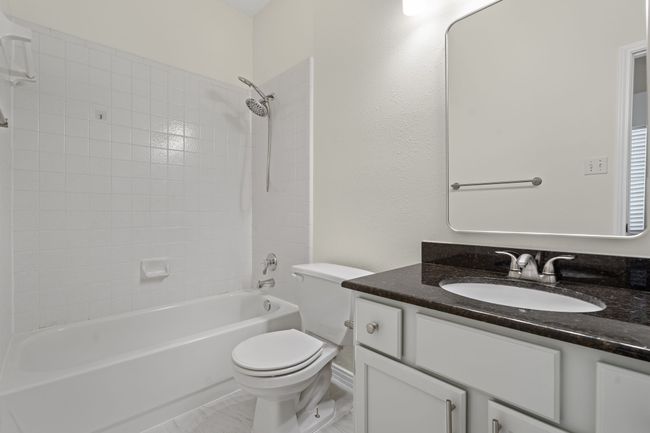 Guest bedroom has ensuite bath with linen closet and medicine cabinet | Image 24