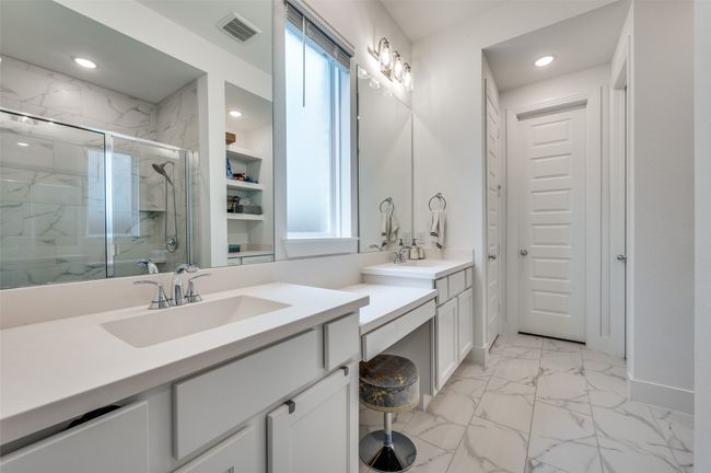Bathroom with marble look tiles, a marble finish shower, vanity, and recessed lighting | Image 14