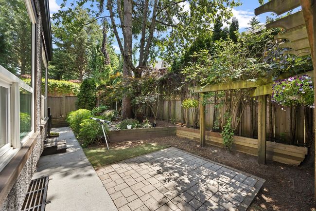 Fenced backyard featuring a patio area | Image 29