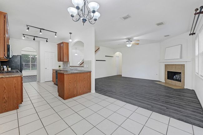 View from breakfast table area looking towards the kitchen and living rooms. | Image 12