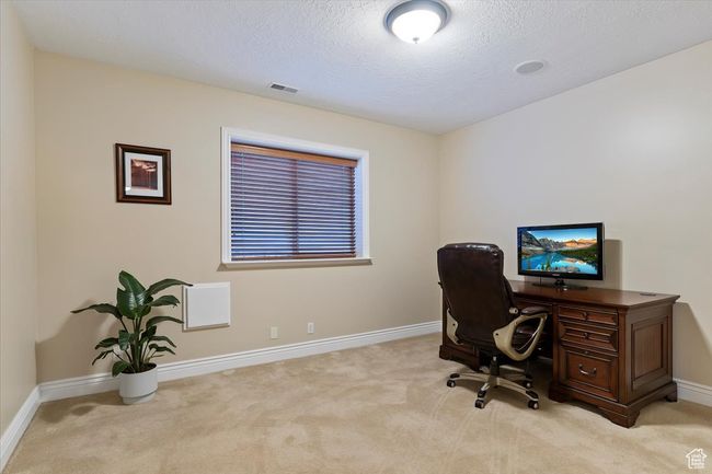 Office area with a textured ceiling, baseboards, and light colored carpet | Image 31