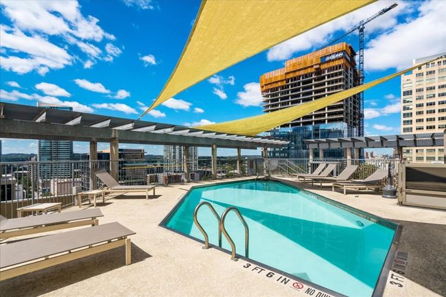 Community pool featuring a patio and a city view | Image 30