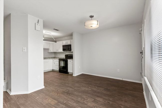 Kitchen open to dining area allows for family interaction while preparing meals | Image 11