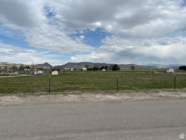 View of road featuring a mountain view and a rural view | Image 13