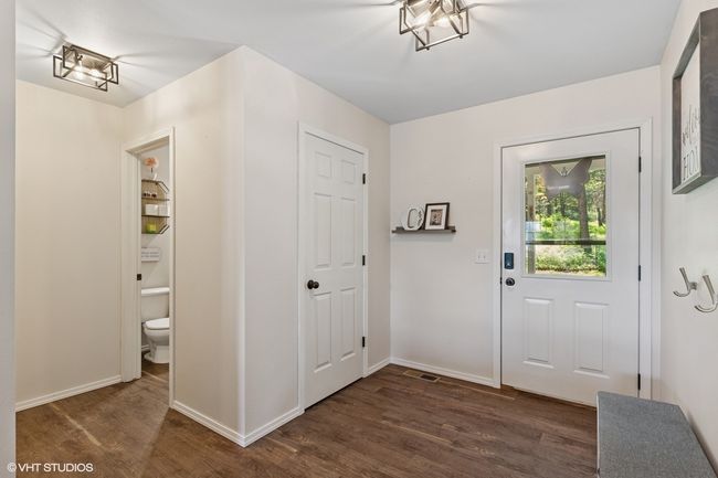 Entrance foyer with dark wood-style flooring and baseboards | Image 4
