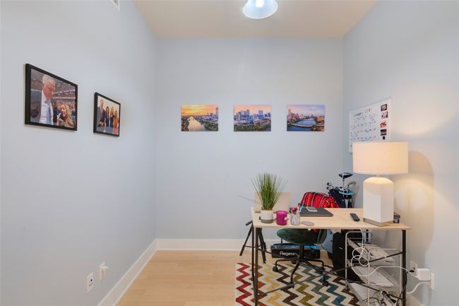 Home office featuring wood finished floors and baseboards | Image 22