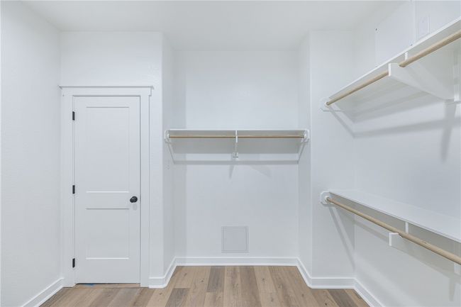 Spacious closet featuring light hardwood / wood-style flooring | Image 20