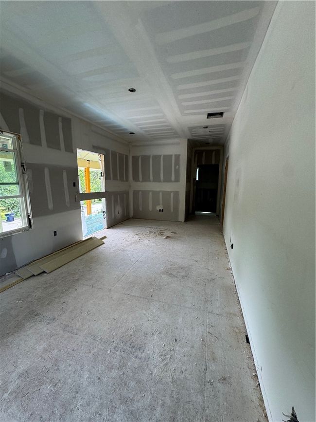 View of unfurnished living room | Image 8