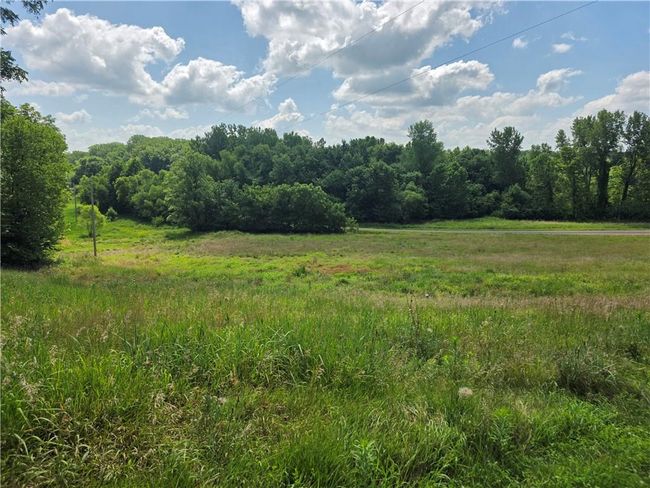 View of tree filled area featuring a view of countryside | Image 12