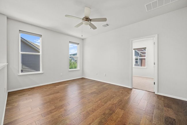 Unfurnished room with a ceiling fan and hardwood / wood-style floors | Image 19